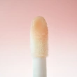 Блеск для губ `REVOLUTION` POUT BOMB с эффектом объема тон Milky sheer holo