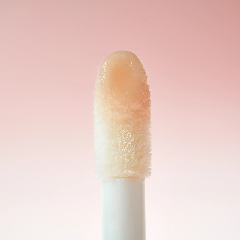 Блеск для губ `REVOLUTION` POUT BOMB с эффектом объема тон Milky sheer holo